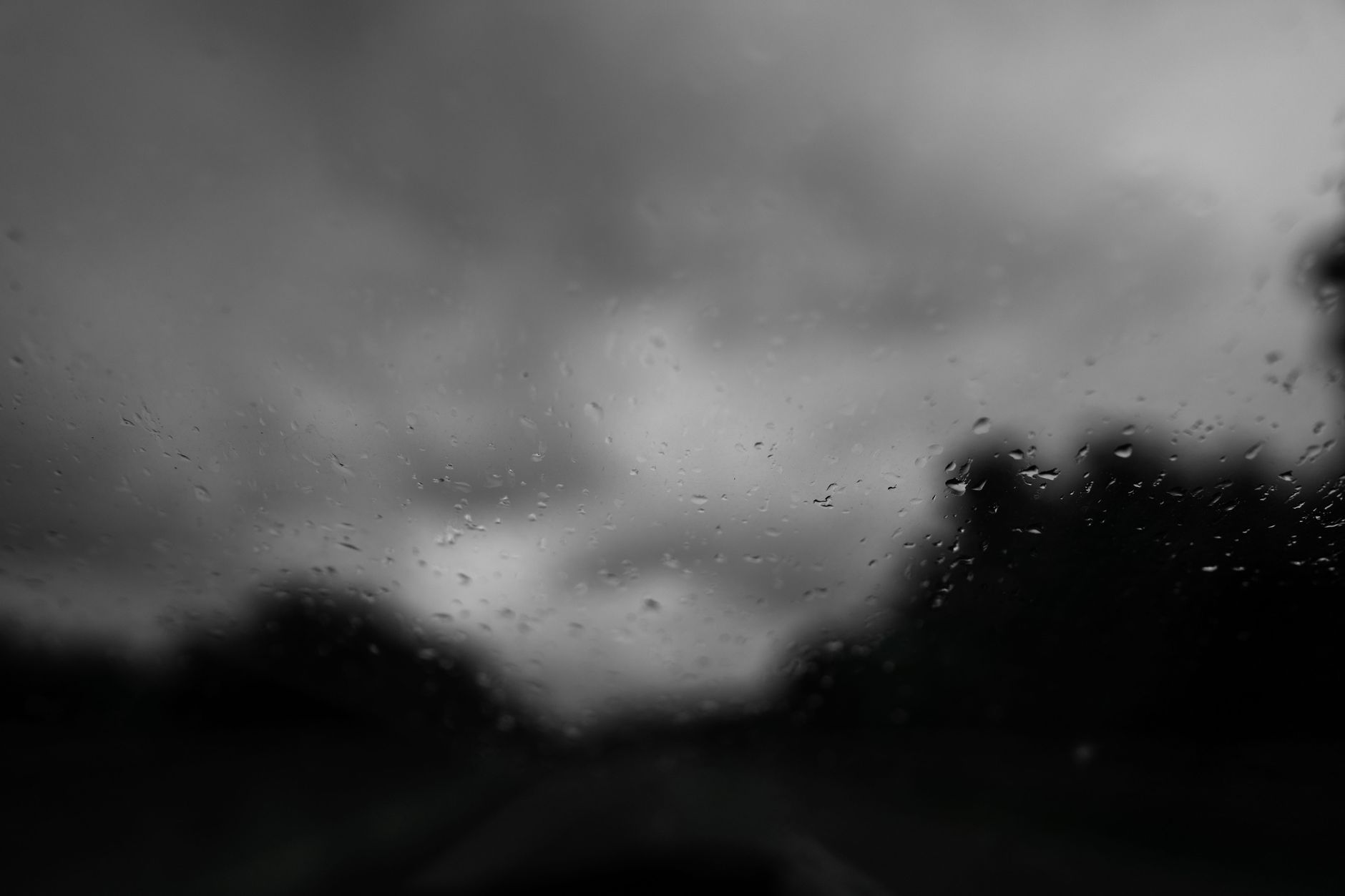 grayscale photo of a glass with water droplets