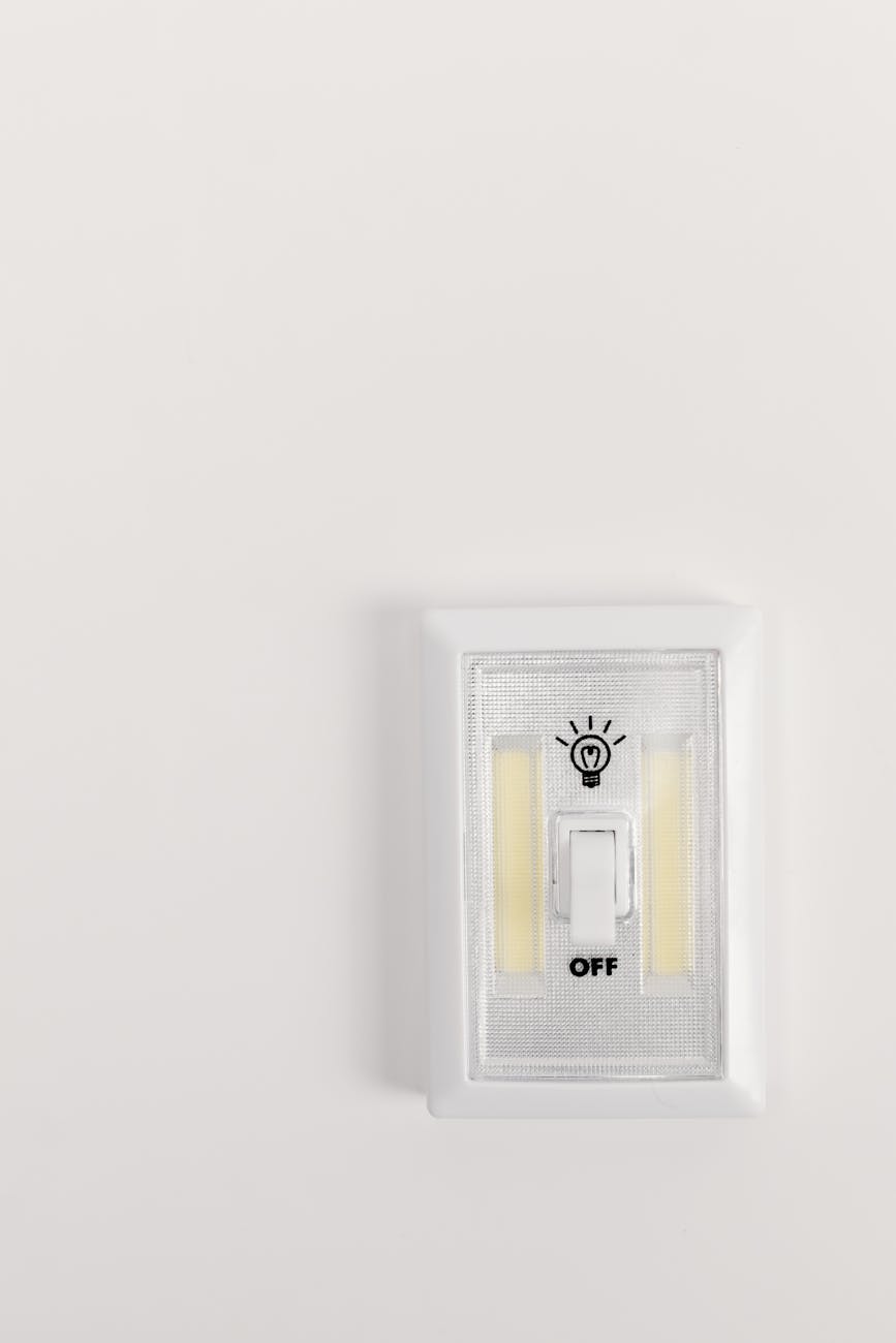 white electric switch mounted on white wall